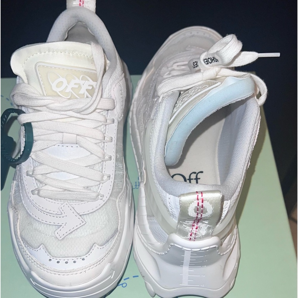 Womens off-white sneakers.